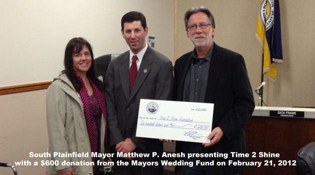 Receiving donation from South Plainfield Mayor Anesh